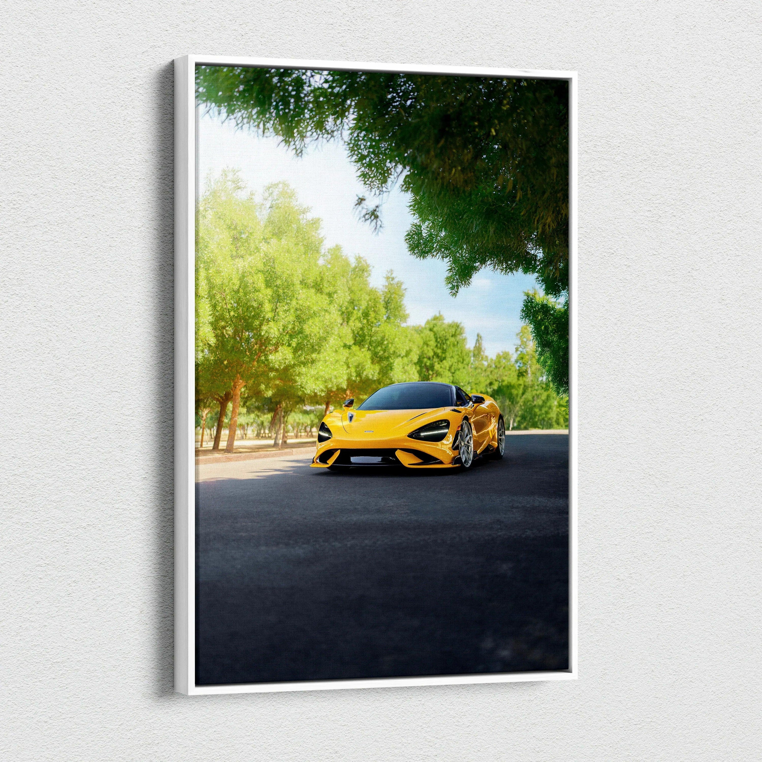 Yellow McLaren 765LT driving on tree-lined road vertical canvas wall art.
