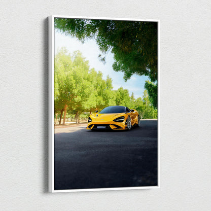 Yellow McLaren 765LT driving on tree-lined road vertical canvas wall art.