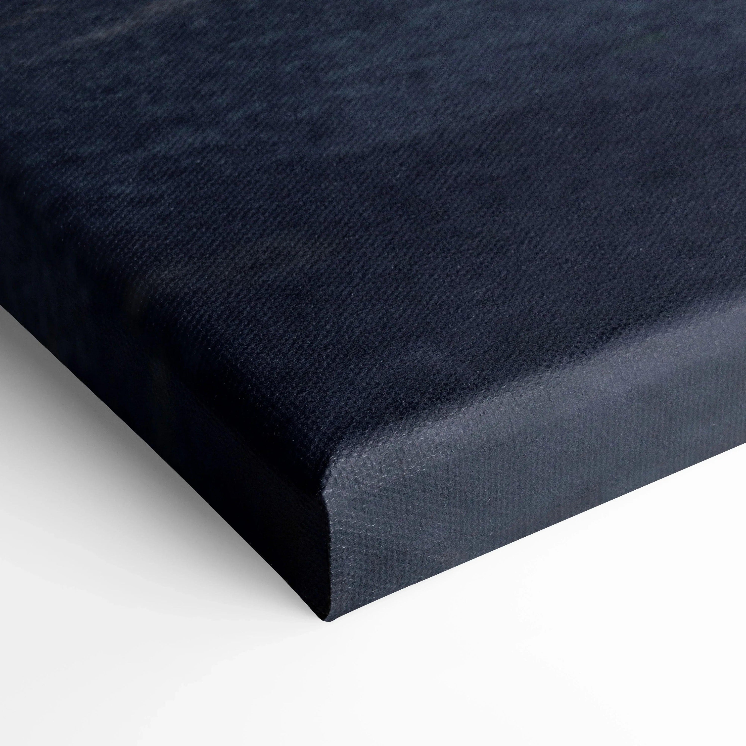 Black canvas wall art with textured fabric surface and wrapped edges.