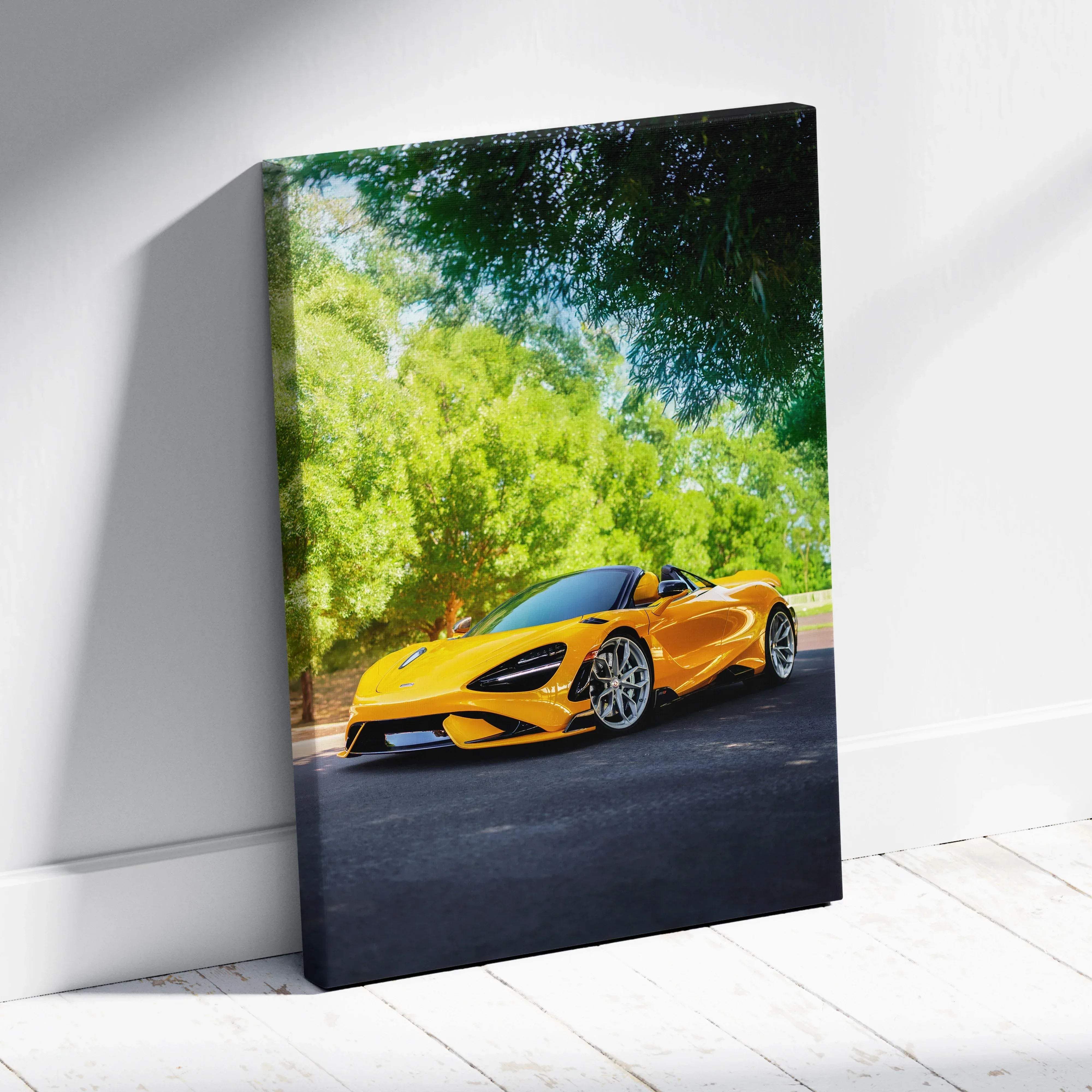 Canvas wall art featuring a vibrant yellow McLaren 720s convertible sports car on a lush green backdrop
