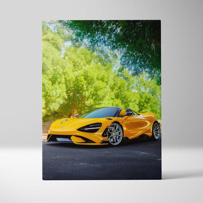 Vertical canvas wall art featuring a vibrant yellow McLaren 765LT sports car against lush green trees.