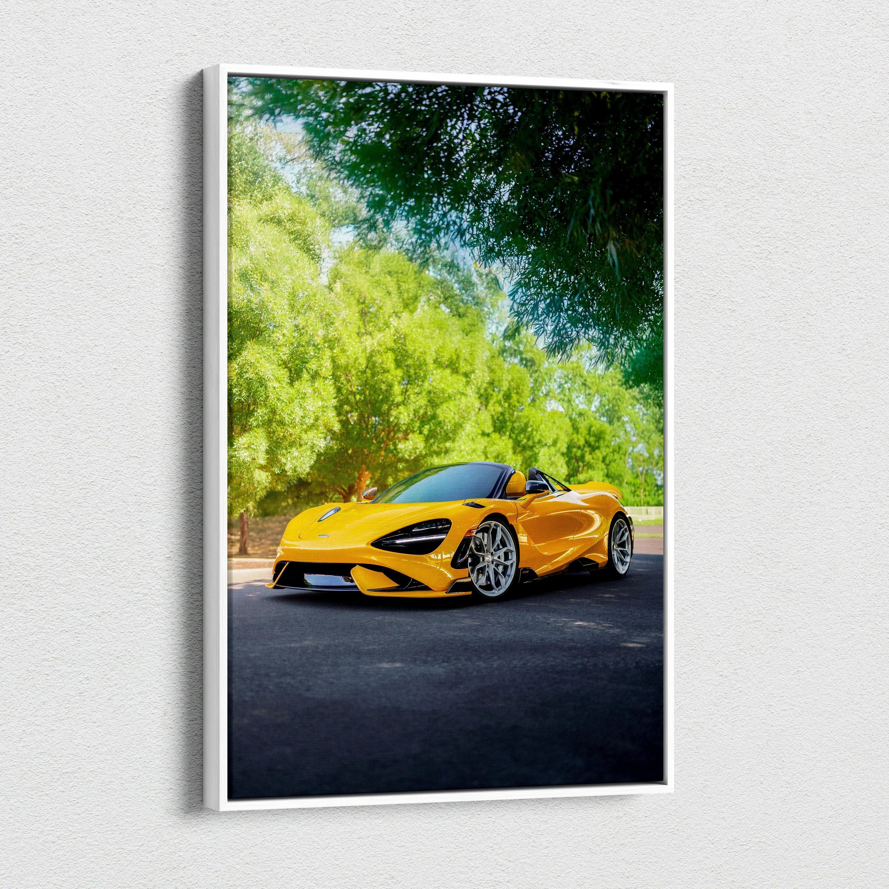 Vertical canvas wall art of bright yellow McLaren 765LT sports car under green trees.