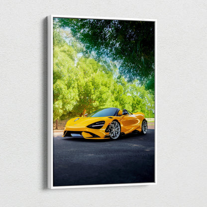 Vertical canvas wall art of bright yellow McLaren 765LT sports car under green trees.