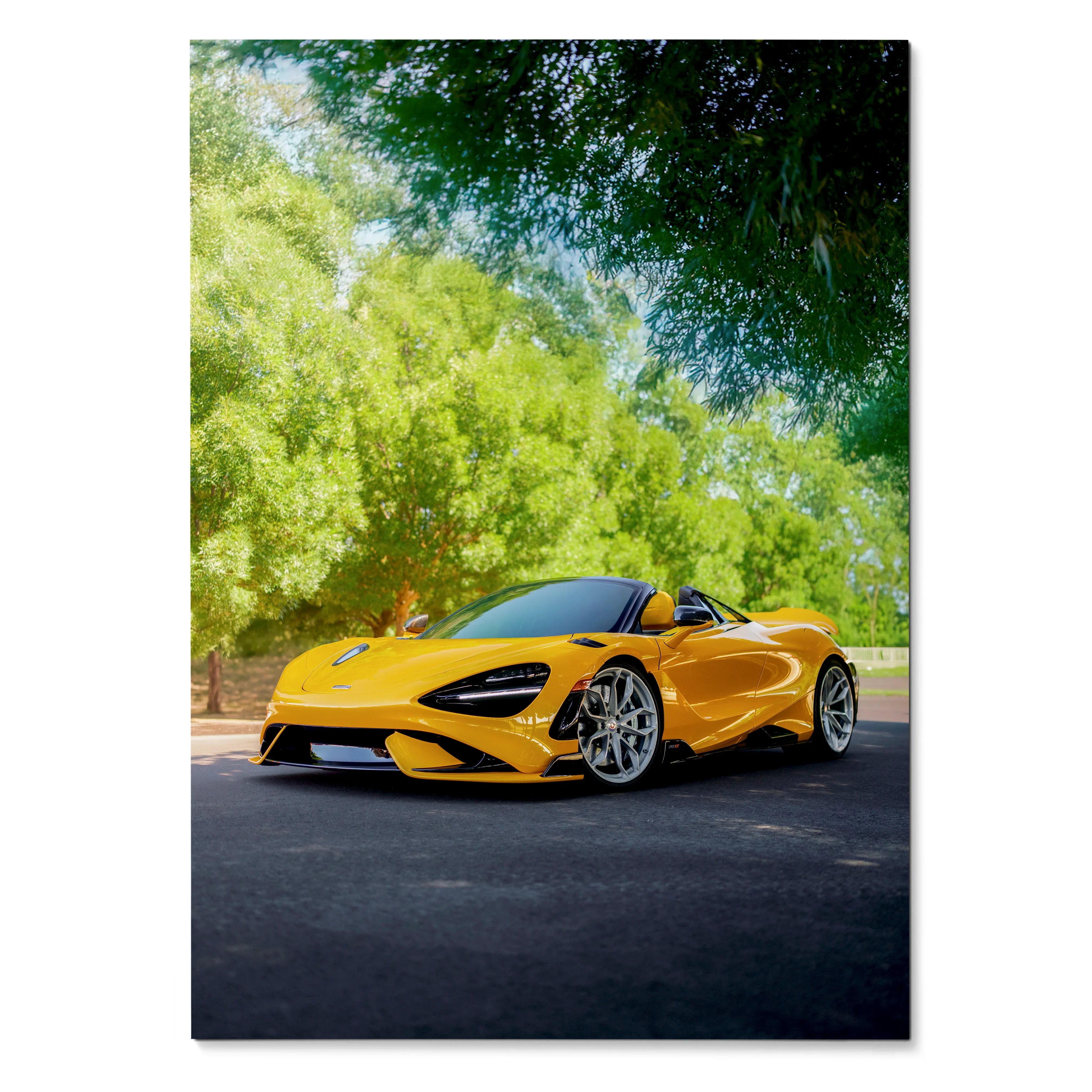 Yellow McLaren 765LT sports car parked outdoors with trees in background poster wall art.