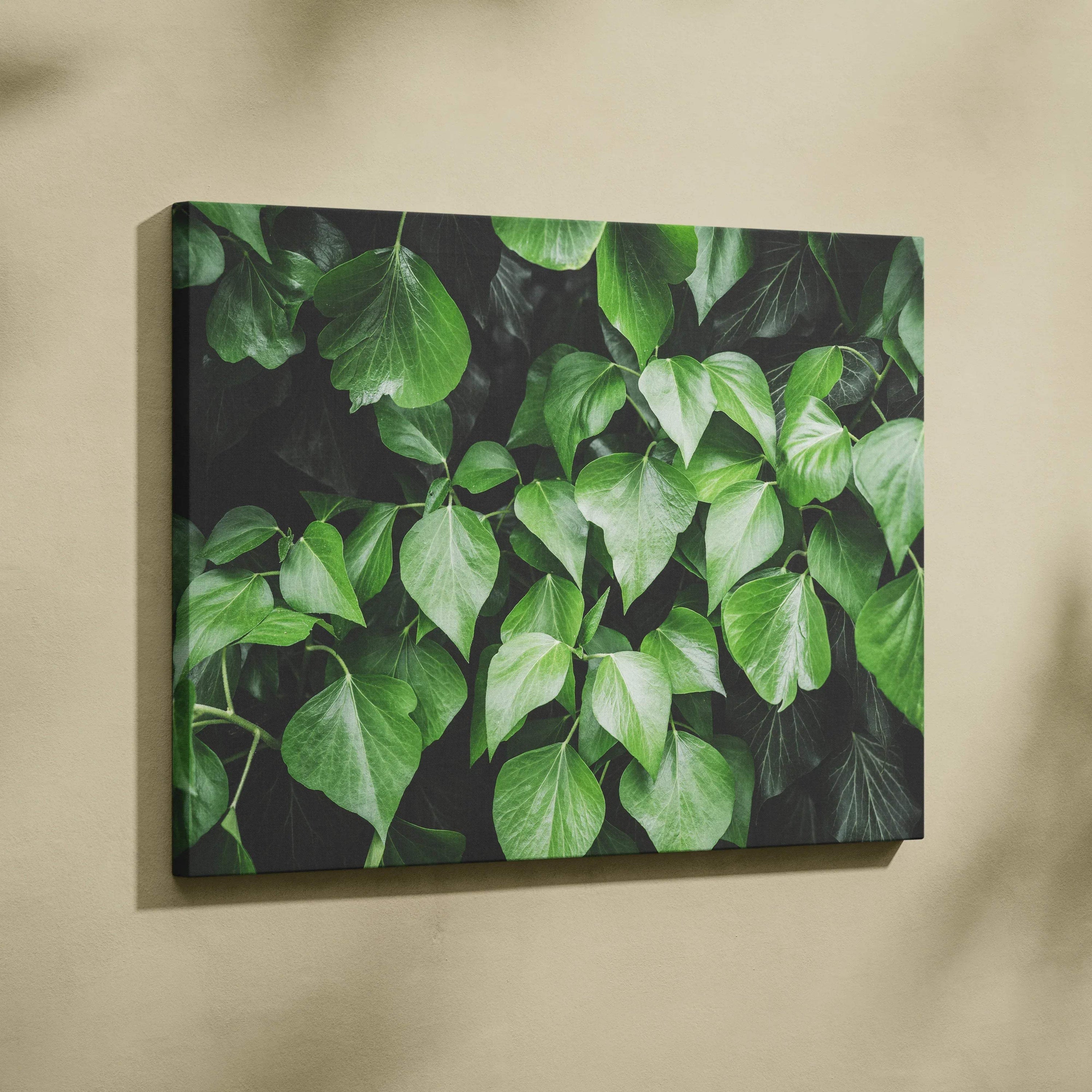 Lush green leaves floral canvas wall art with dark background, modern nature decor.