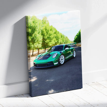 Porsche 911 GT3 RS green sports car driving on tree-lined road canvas wall art.