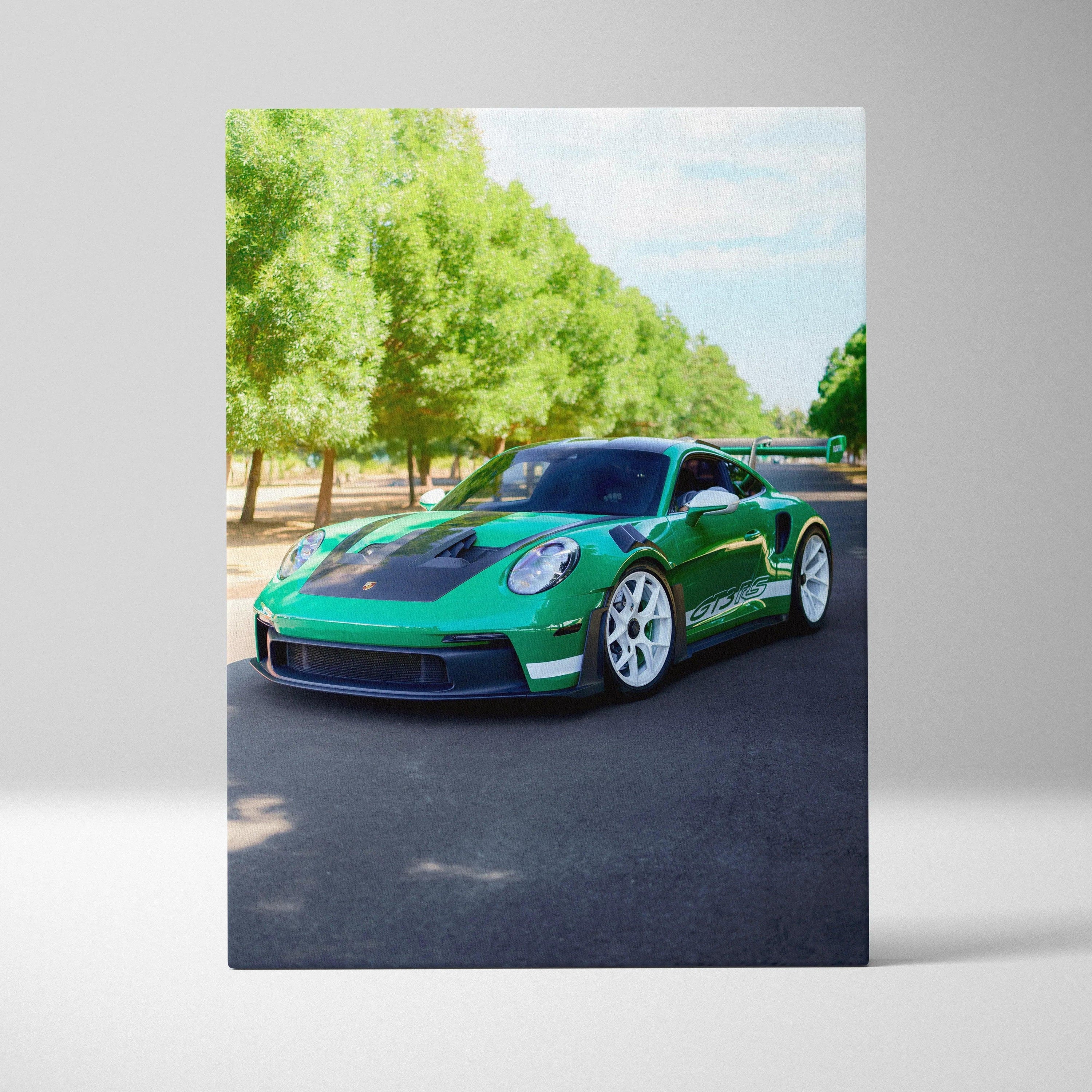 Green Porsche 911 GT3 RS on black asphalt surrounded by trees vertical canvas wall art.