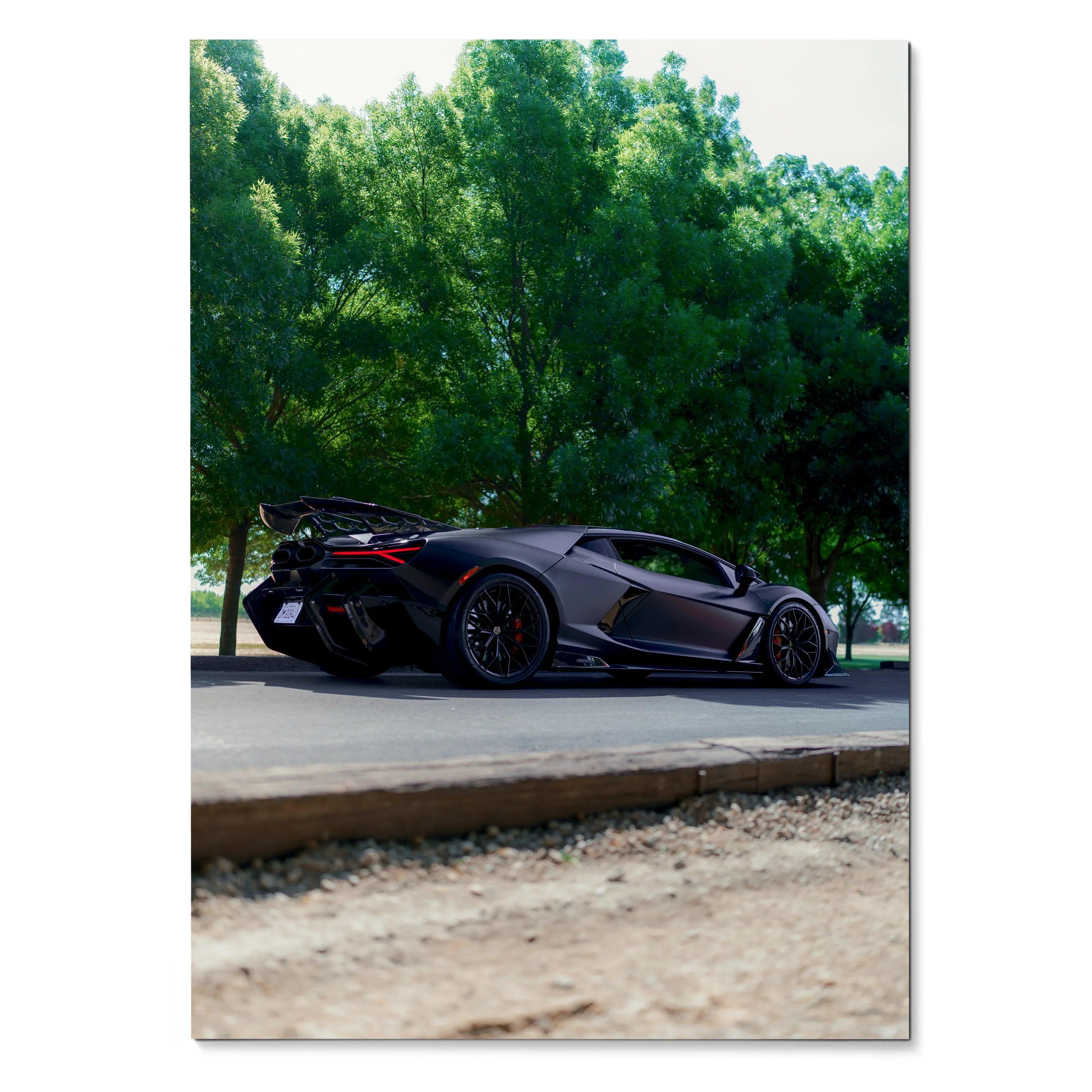 Lamborghini Revuelto black sports car parked near green trees poster wall art.