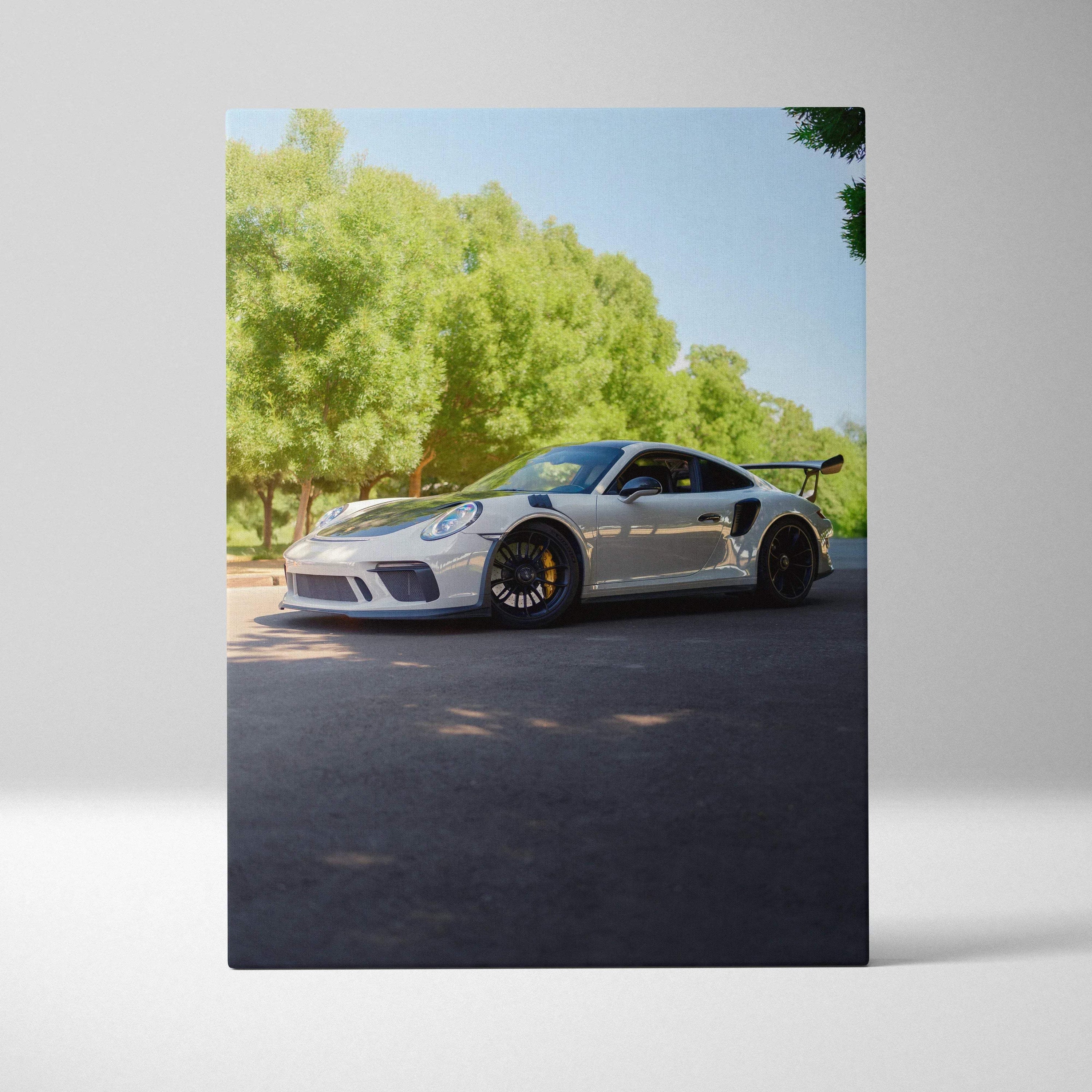 Porsche 911 GT3 sports car canvas art with trees and clear sky vertical wall art.
