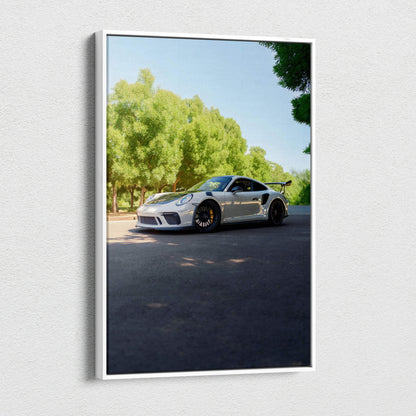 Vertical canvas wall art featuring a Porsche 911 GT3 parked under trees in bright daylight.
