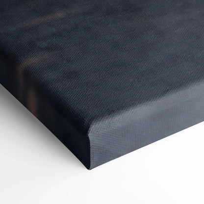 Close-up of black textured canvas wall art with deep gallery wrap corner.