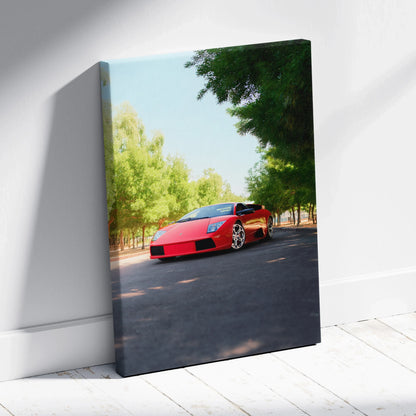 Vertical canvas art of red Lamborghini Murcielago parked on sunlit tree-lined road.