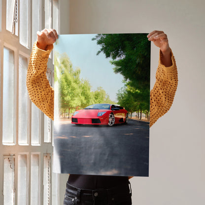 Lamborghini Murcielago poster showing red sports car on tree-lined road as wall art.