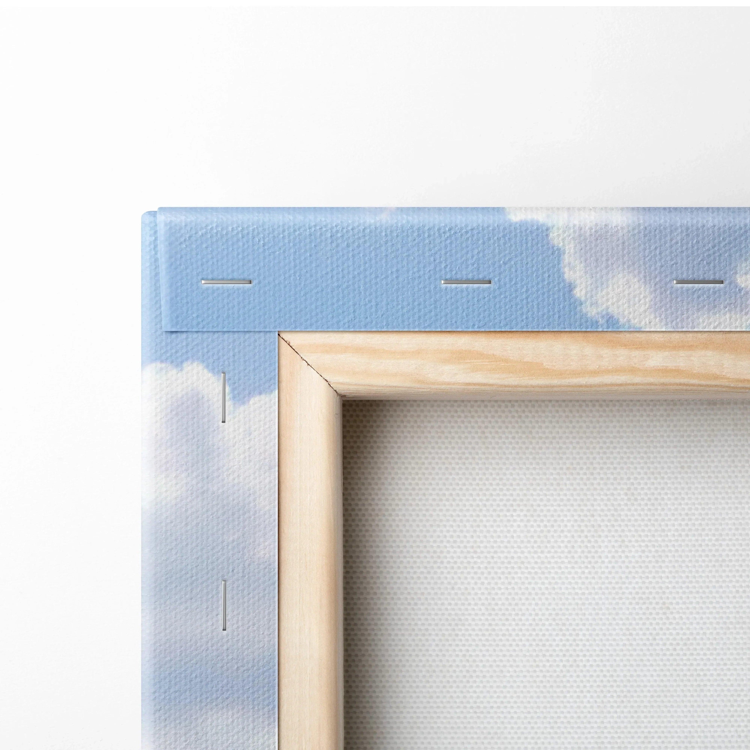 Close-up of wooden frame on canvas art featuring blue sky and white clouds, vertical wall art print.