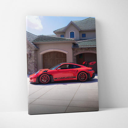 Red Porsche 911 GT3 RS parked in front of luxury home canvas wall art vertical print.