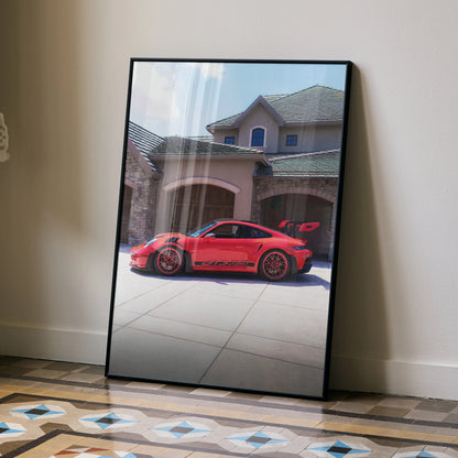 Porsche 911 GT3 RS red car poster with black frame leaning on wall wall art.