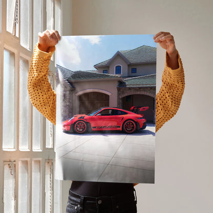 Poster of a red Porsche 911 GT3 RS parked in front of a modern house, vibrant wall art.