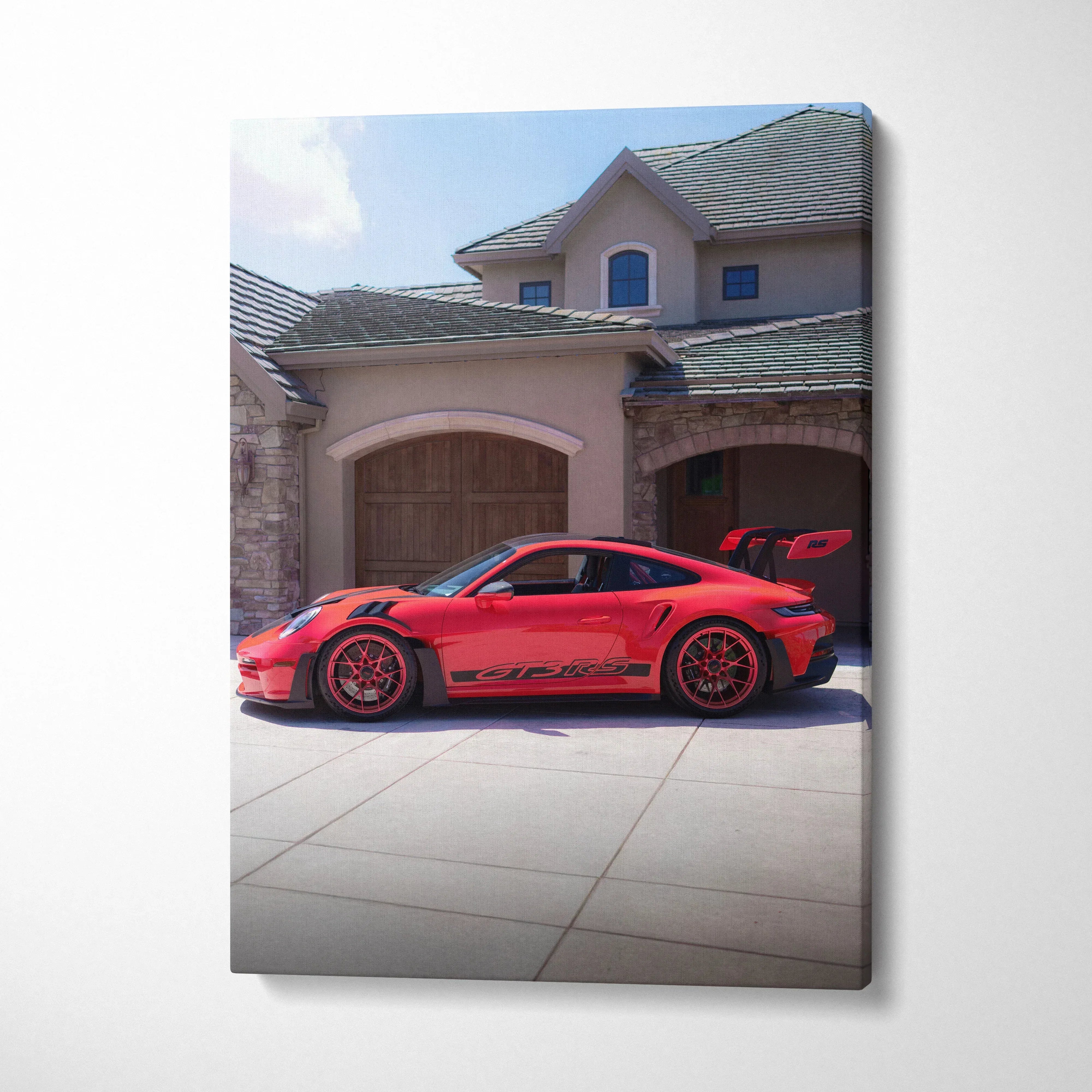 Red Porsche 911 GT3 RS sports car parked in front of luxury house, vertical canvas wall art.
