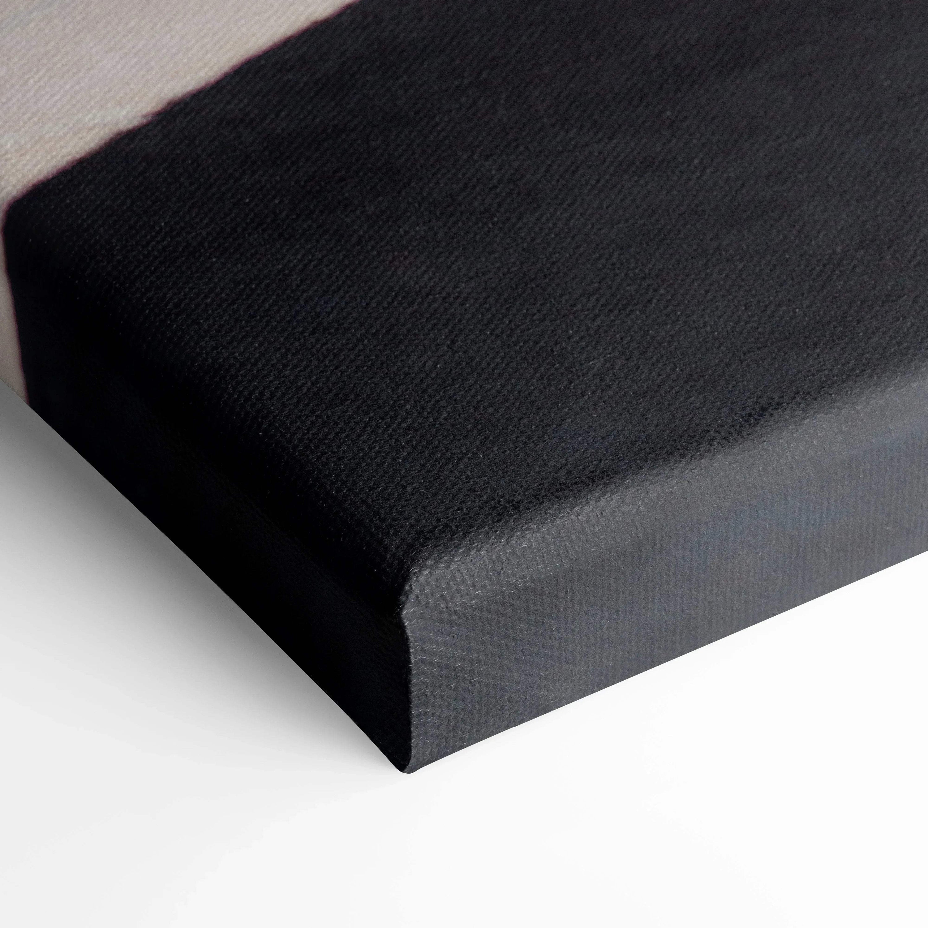 Close-up of black stretched canvas corner showcasing texture and sharp edges of wall art canvas print.