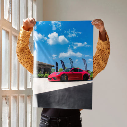 Porsche 911 GT3 red sports car poster with blue sky and modern building wall art.