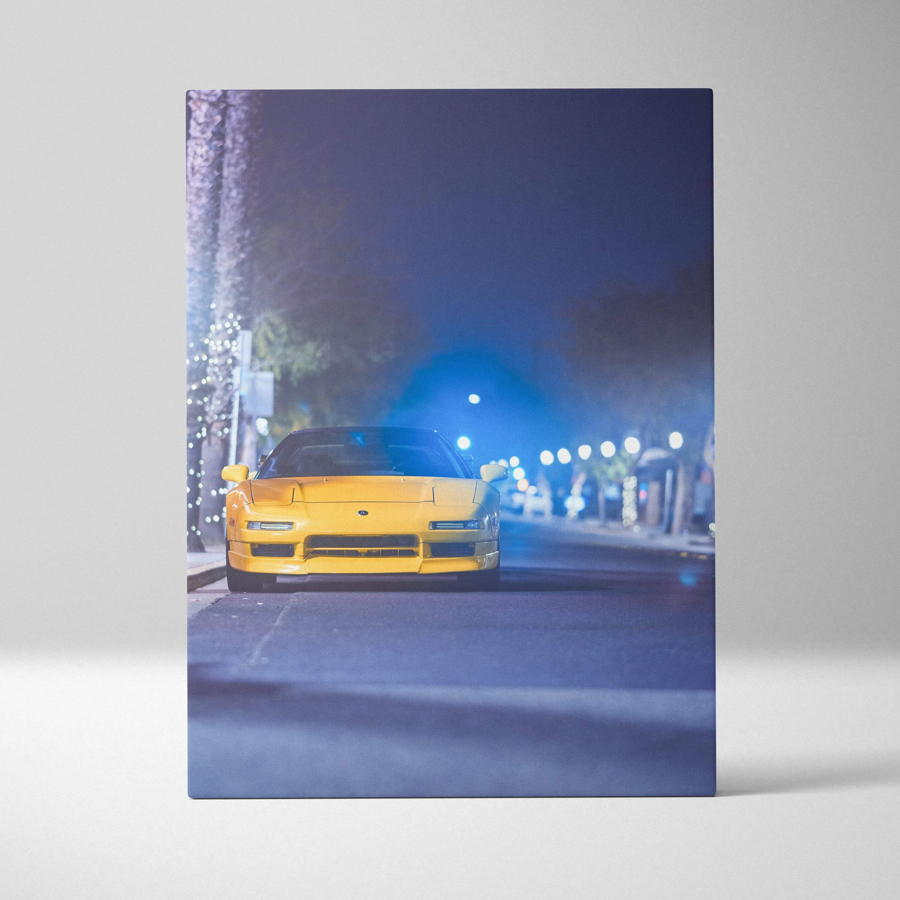 Vertical canvas art featuring a yellow Acura NSX at night with street lamps and a blurred urban background.