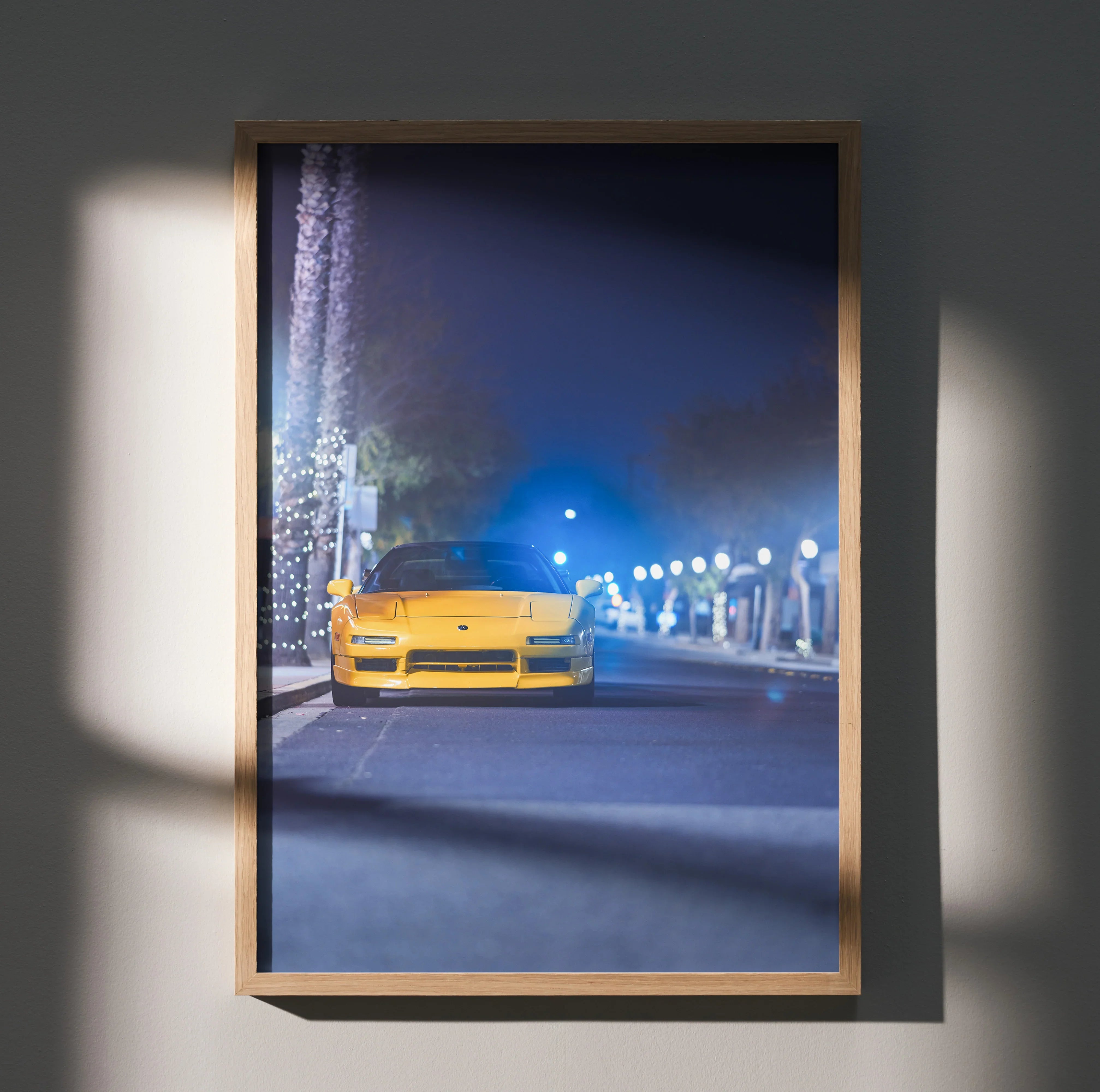 Acura NSX poster wall art featuring a yellow NSX car on a nighttime street with illuminated lampposts.