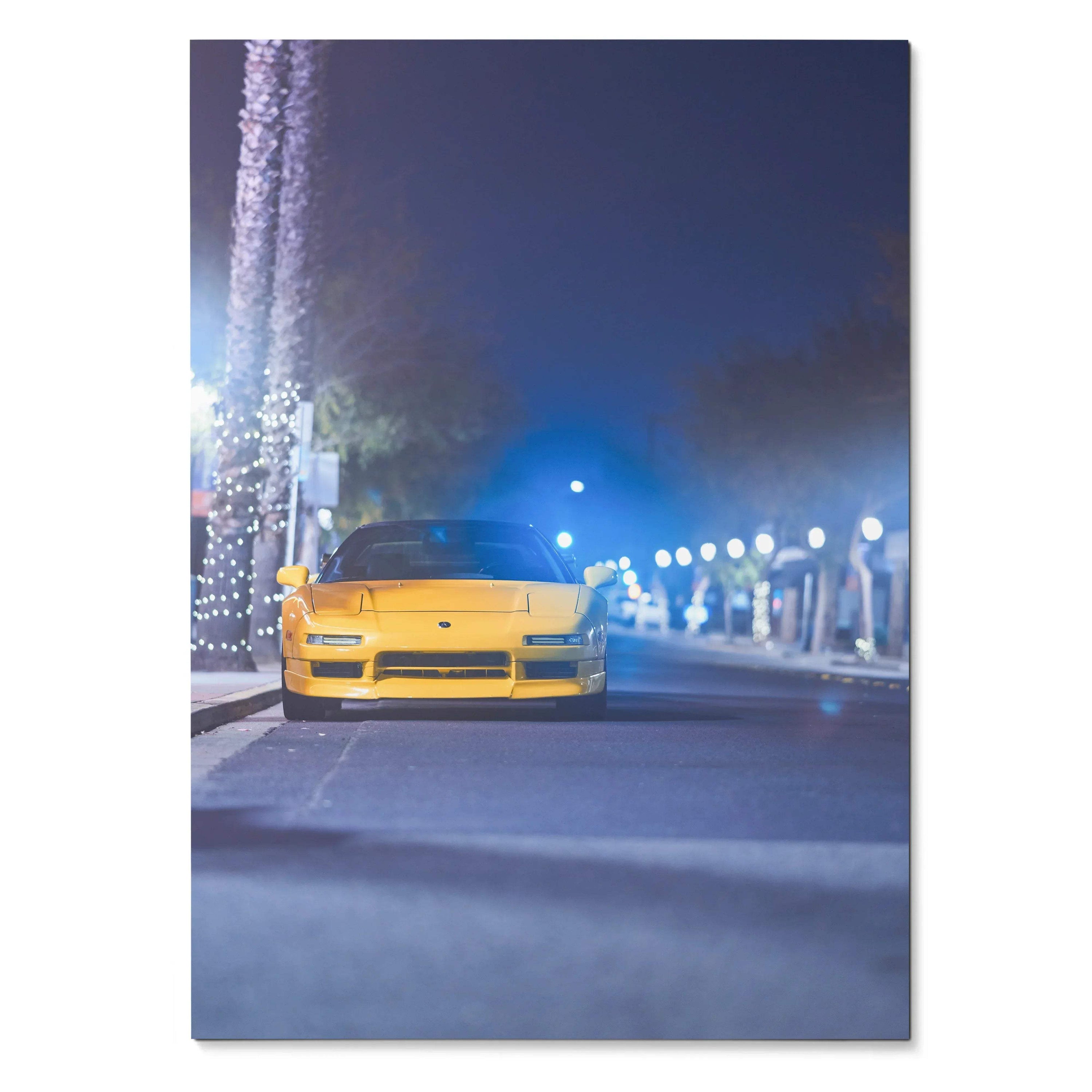 Yellow Acura NSX parked at night with streetlights and palm trees, glossy poster wall art.
