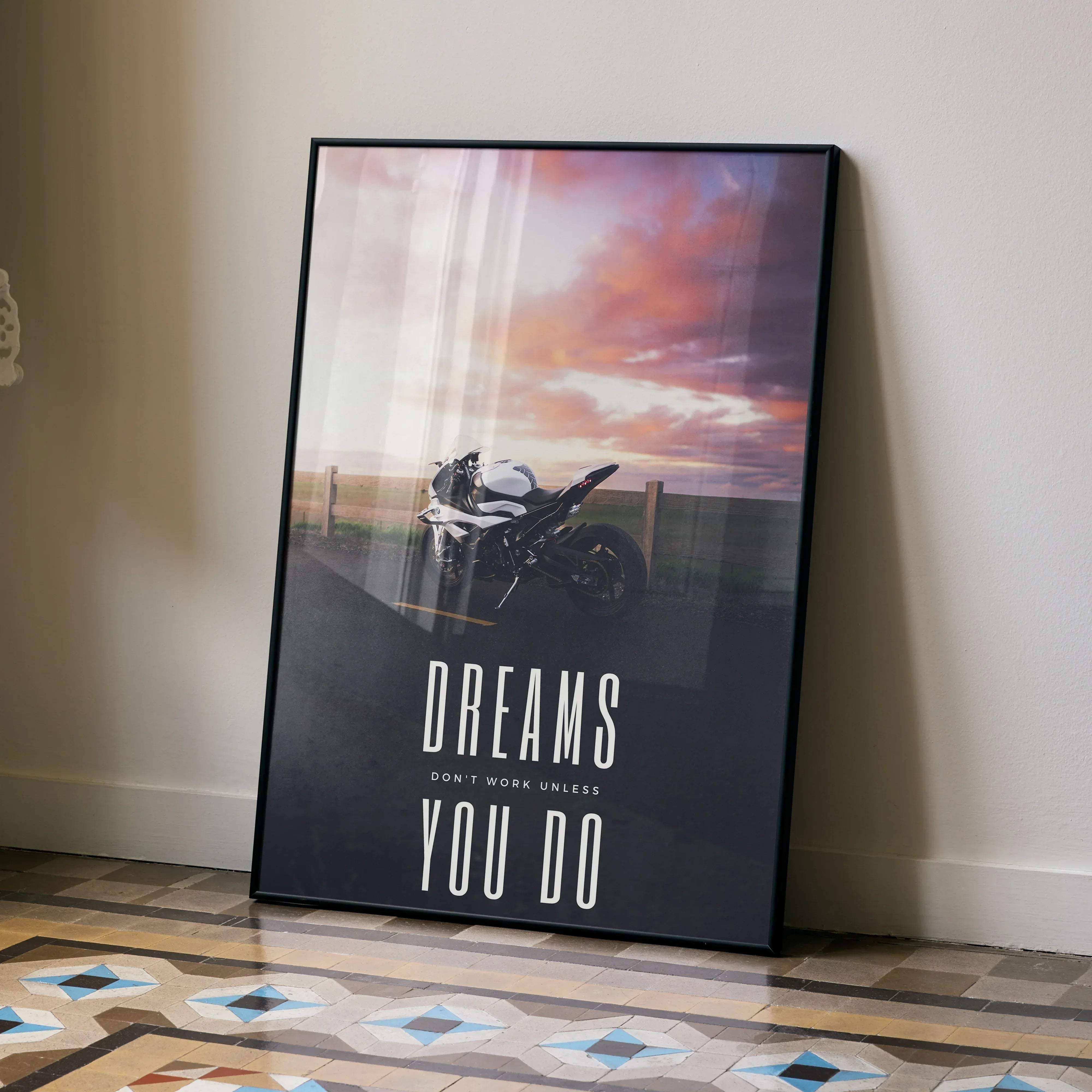 Black-framed bmw inspired motivational poster with a white and black s1000rr motorcycle under a pink sunset with bold text