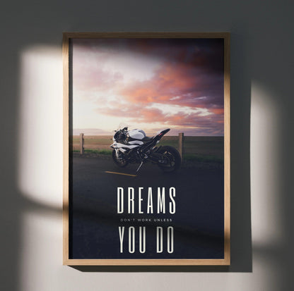 Motivational poster wall art featuring BMW S1000RR motorcycle at sunset with "Dreams Don't Work Unless You Do" text.