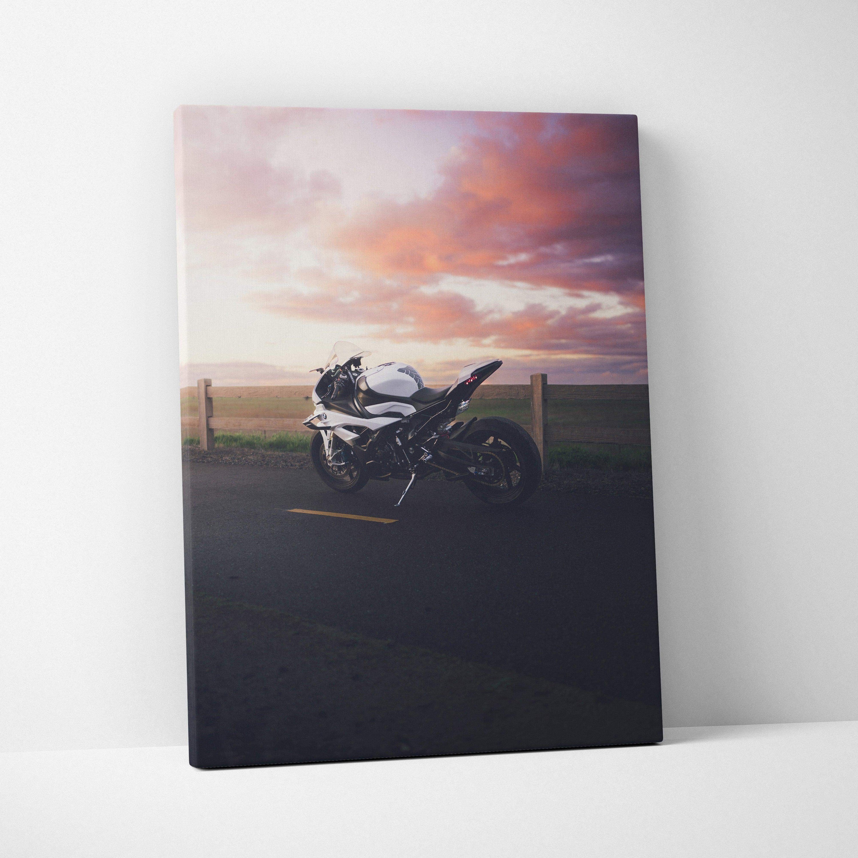BMW S1000RR motorcycle canvas wall art with dramatic sunset sky in high-resolution vertical print.