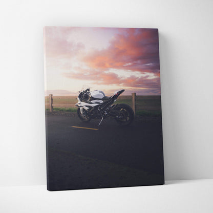 BMW S1000RR motorcycle canvas wall art with dramatic sunset sky in high-resolution vertical print.