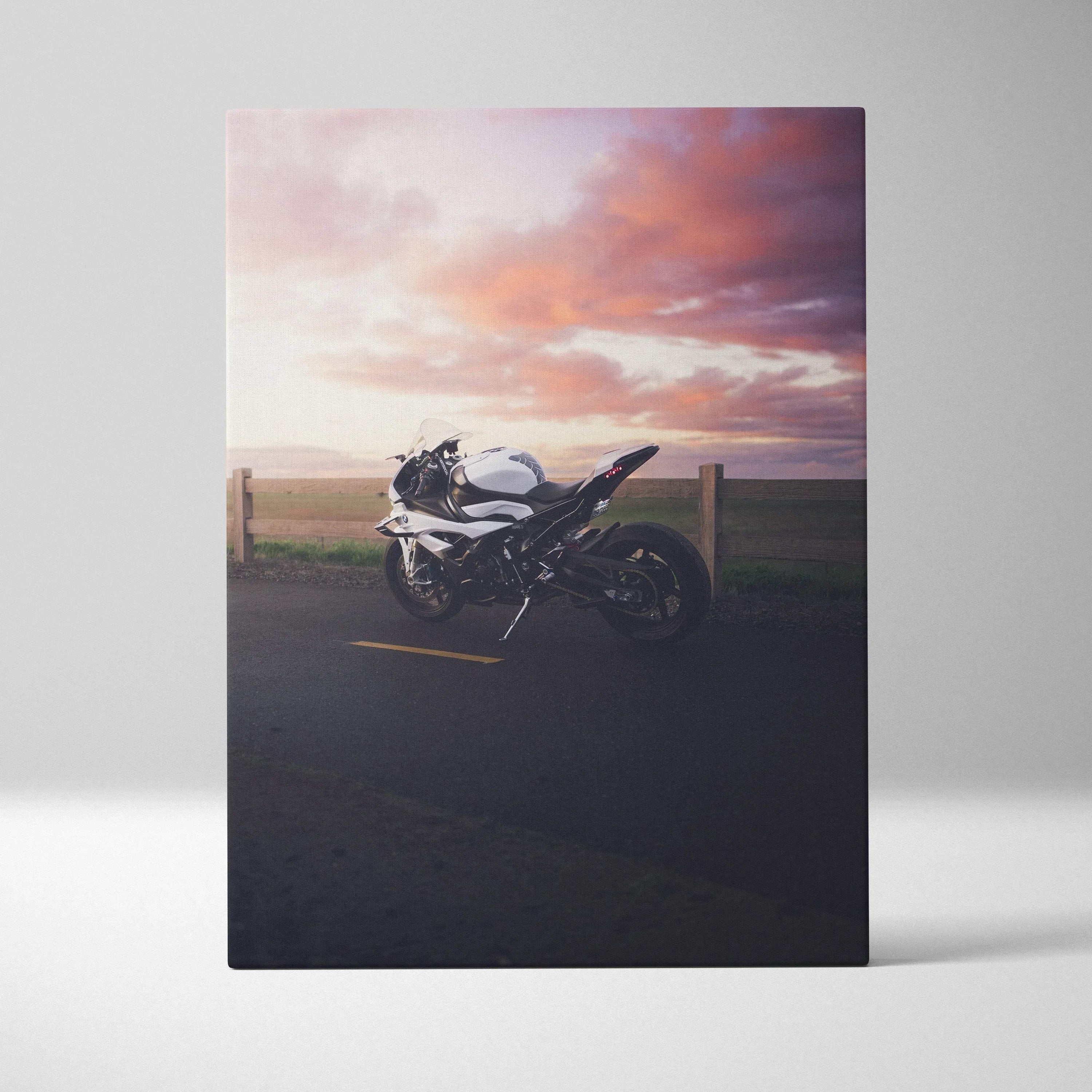 BMW S1000RR motorcycle against a colorful sunset sky on vertical canvas wall art.