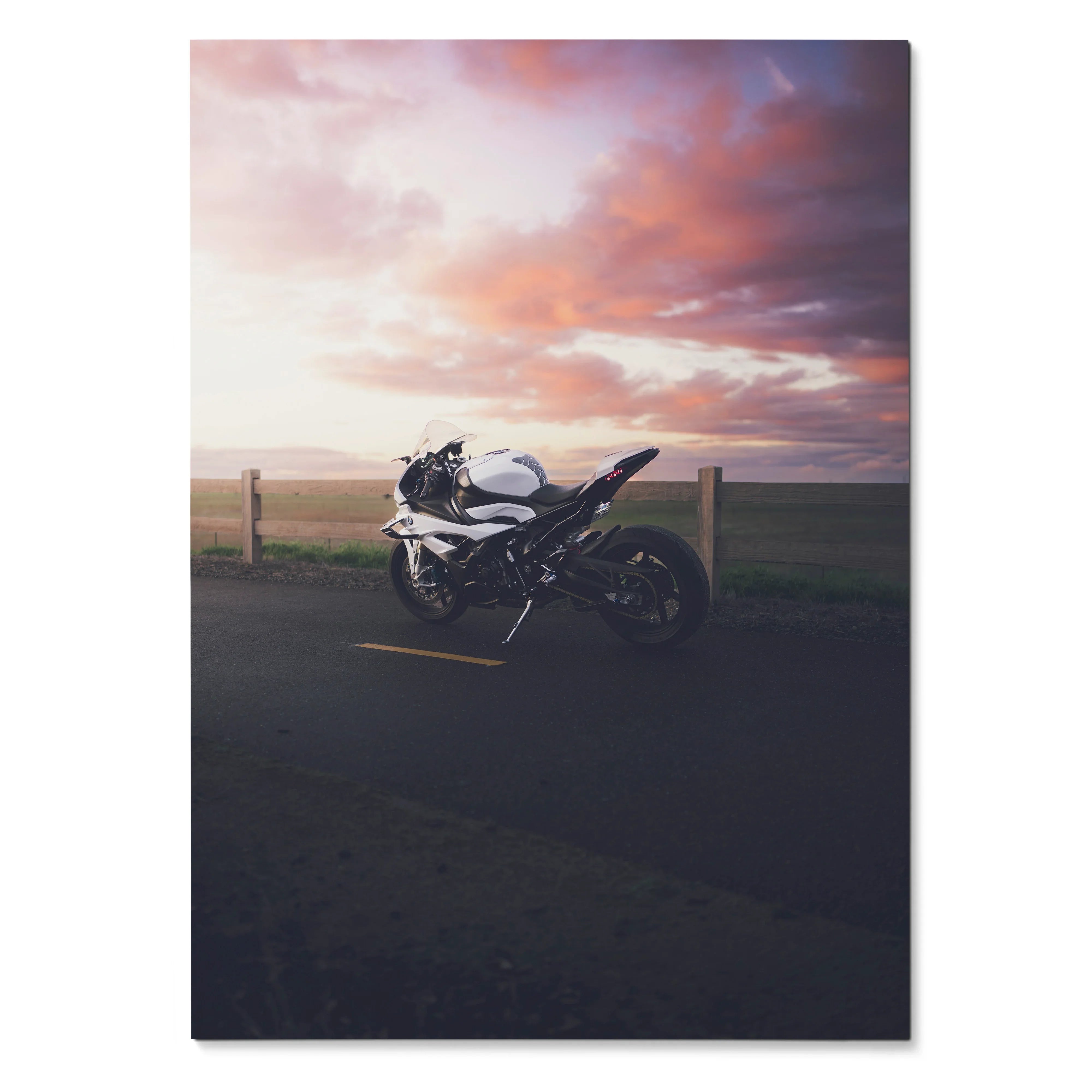 BMW S1000RR motorcycle poster against colorful sunset sky, sleek black and white sport bike wall art.