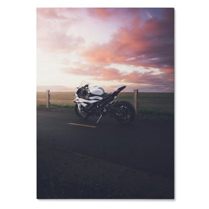 BMW S1000RR motorcycle poster against colorful sunset sky, sleek black and white sport bike wall art.