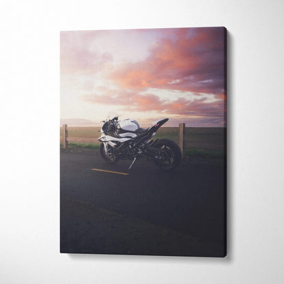 BMW S1000RR motorcycle against a vibrant sunset sky on vertical canvas wall art.