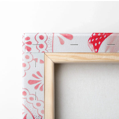 Canvas wall art featuring festive red and white gingerbread cookie patterns with a natural wood frame.