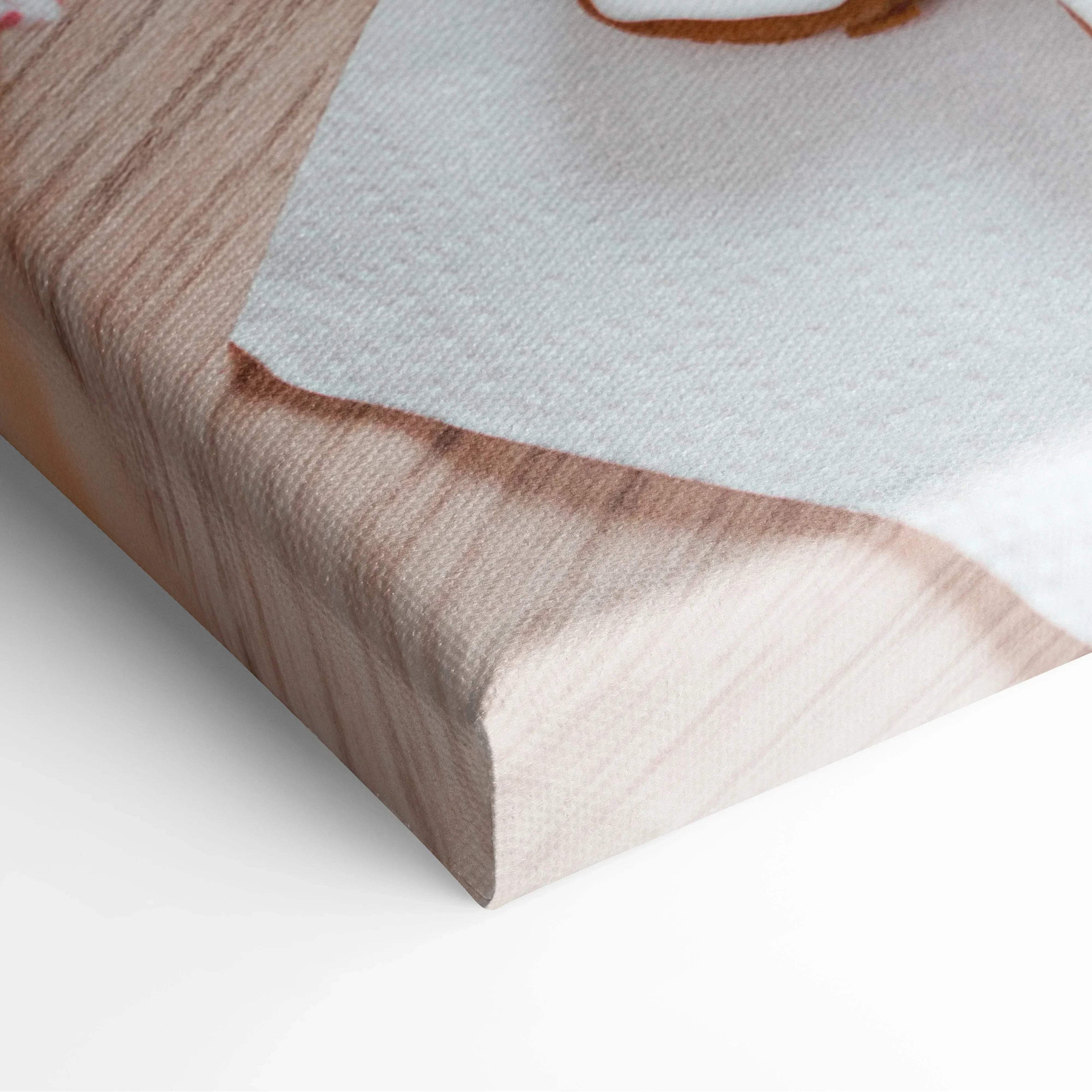Canvas wall art featuring festive holiday gingerbread cookies with white icing on a light wooden background.