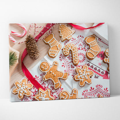 Canvas wall art featuring festive gingerbread cookies in various shapes on a white and red patterned background, accented.
