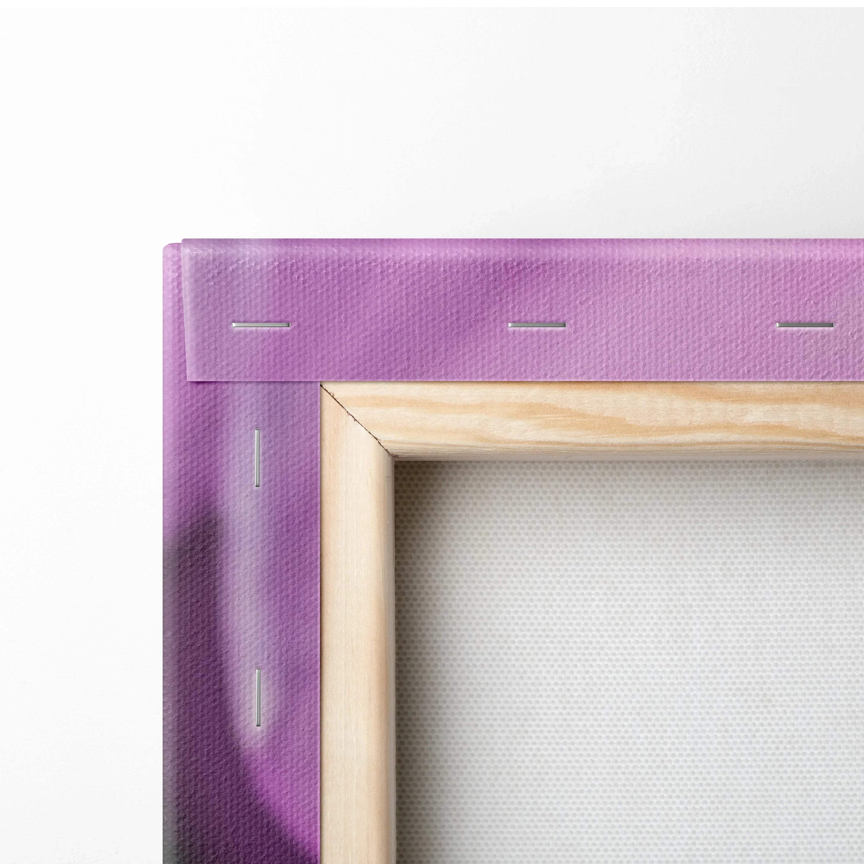 Close-up of wooden frame with purple canvas stretched and stapled for floral wall art decor.