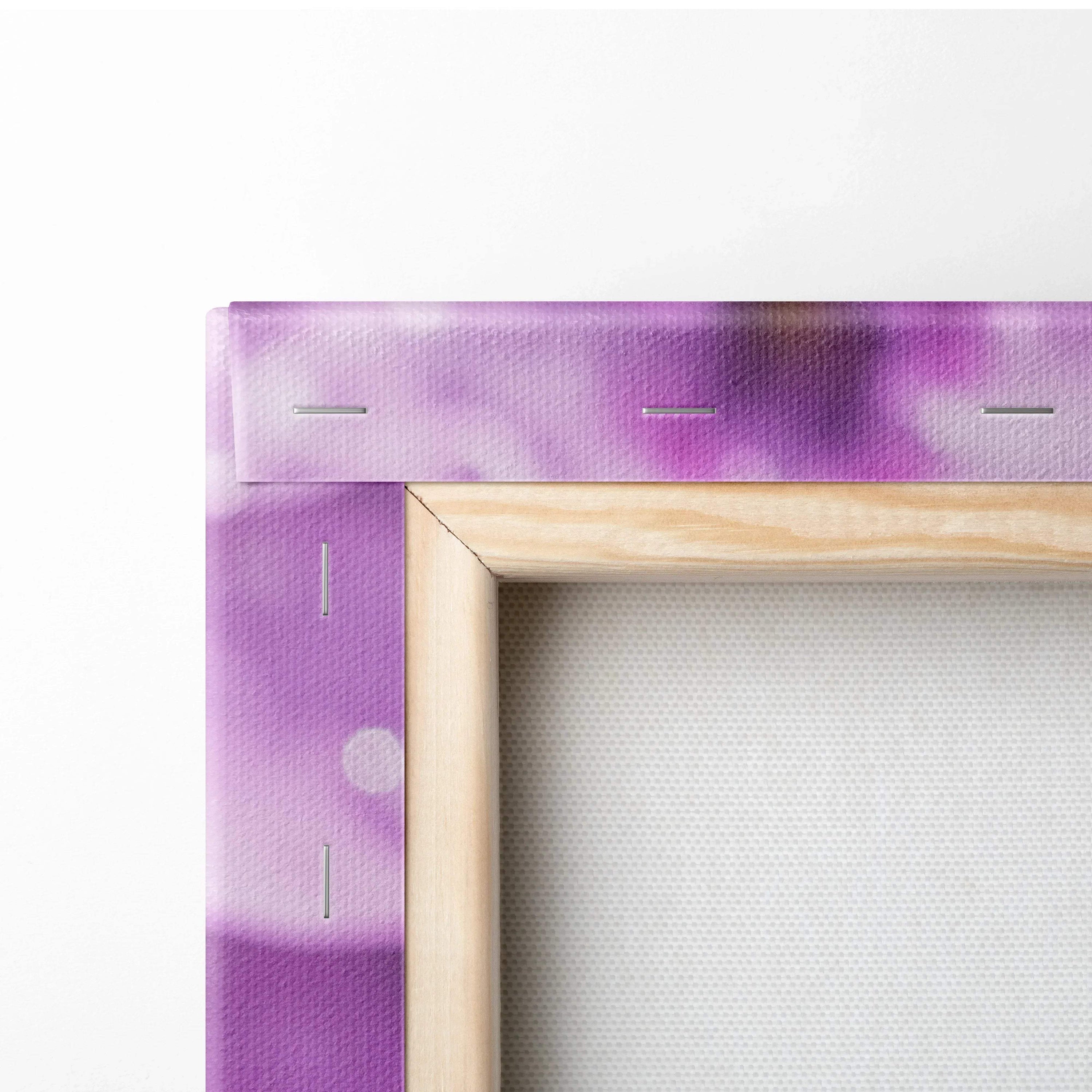 Corner of purple floral canvas wall art stretched on natural wood frame with metal staples.
