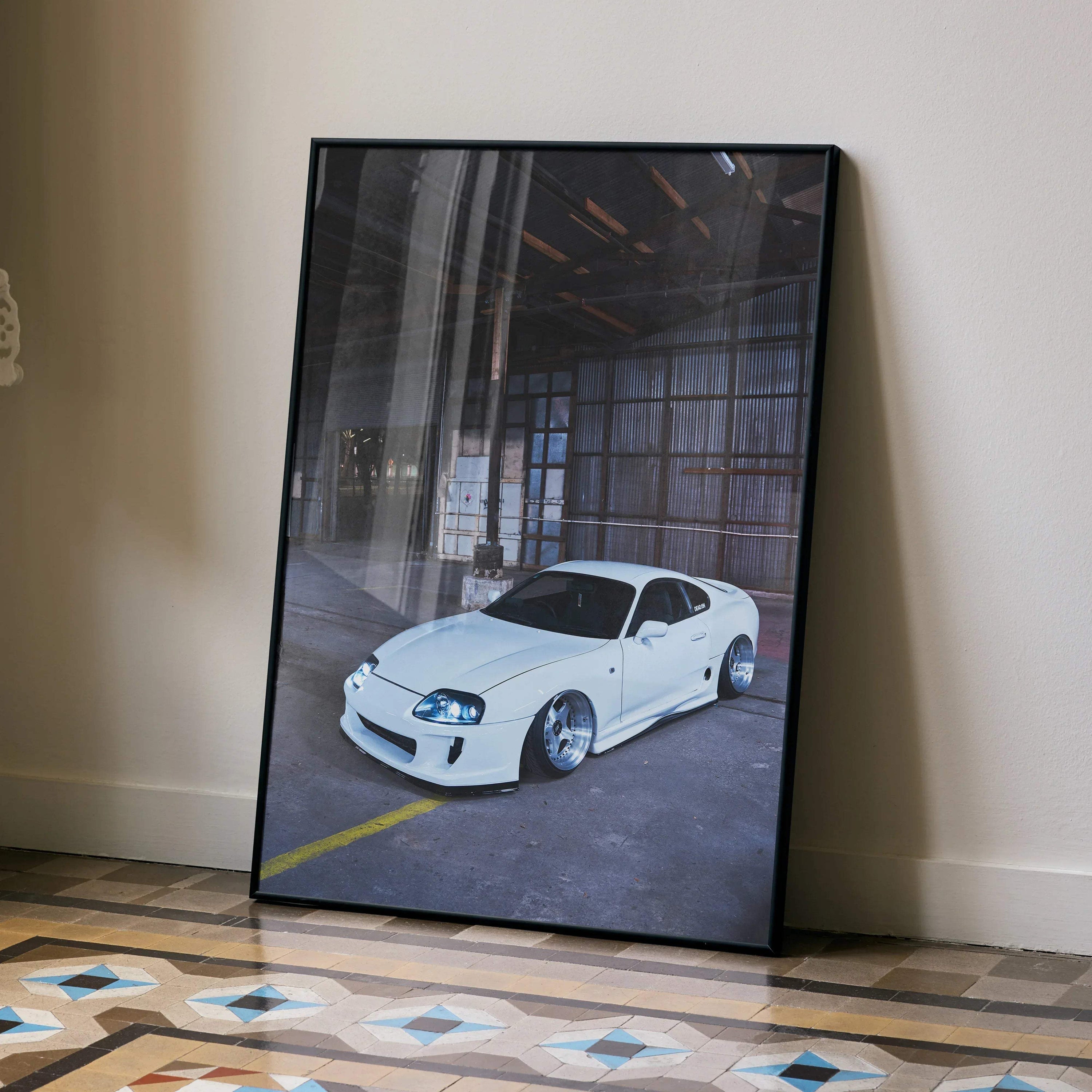 Toyota Supra MK4 white sports car poster leaning against wall, high-resolution automotive wall art.
