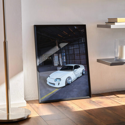 White Toyota Supra MK4 parked inside a dark industrial garage poster wall art in black frame.