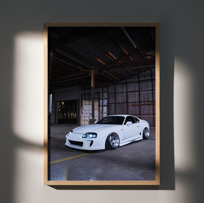 Toyota Supra MK4 white sports car parked in industrial warehouse poster wall art.