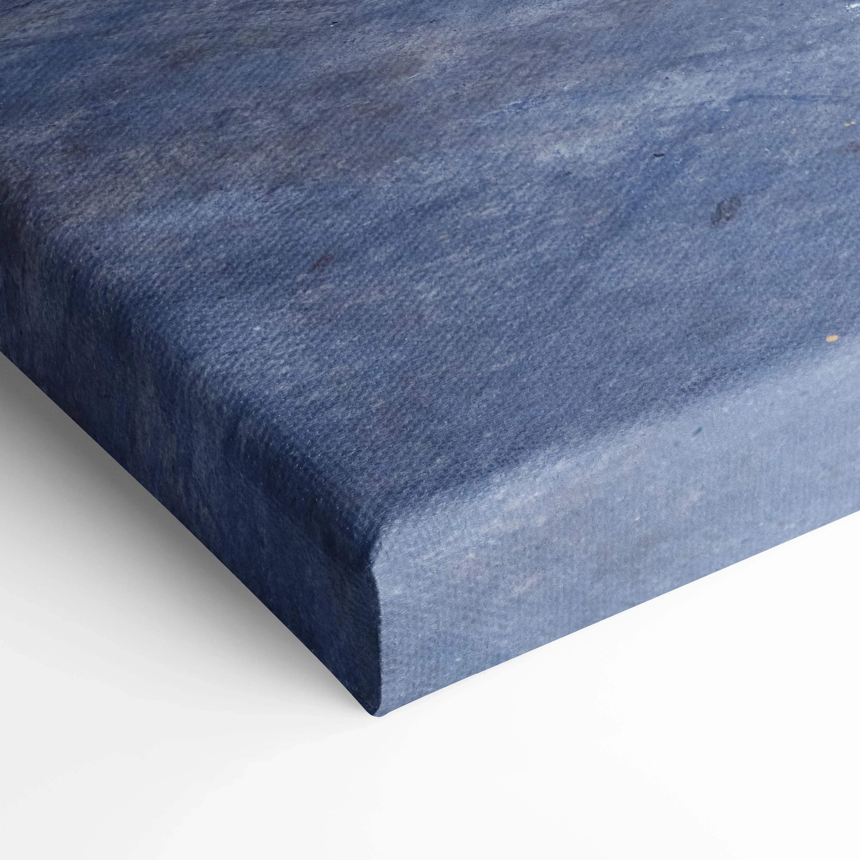 Close-up of textured blue canvas art corner showcasing premium wall art material and edge wrapping.