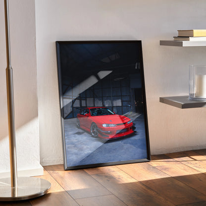 Nissan 240sx S14 Kouki red sports car wall art poster in black frame leaning on wood floor.