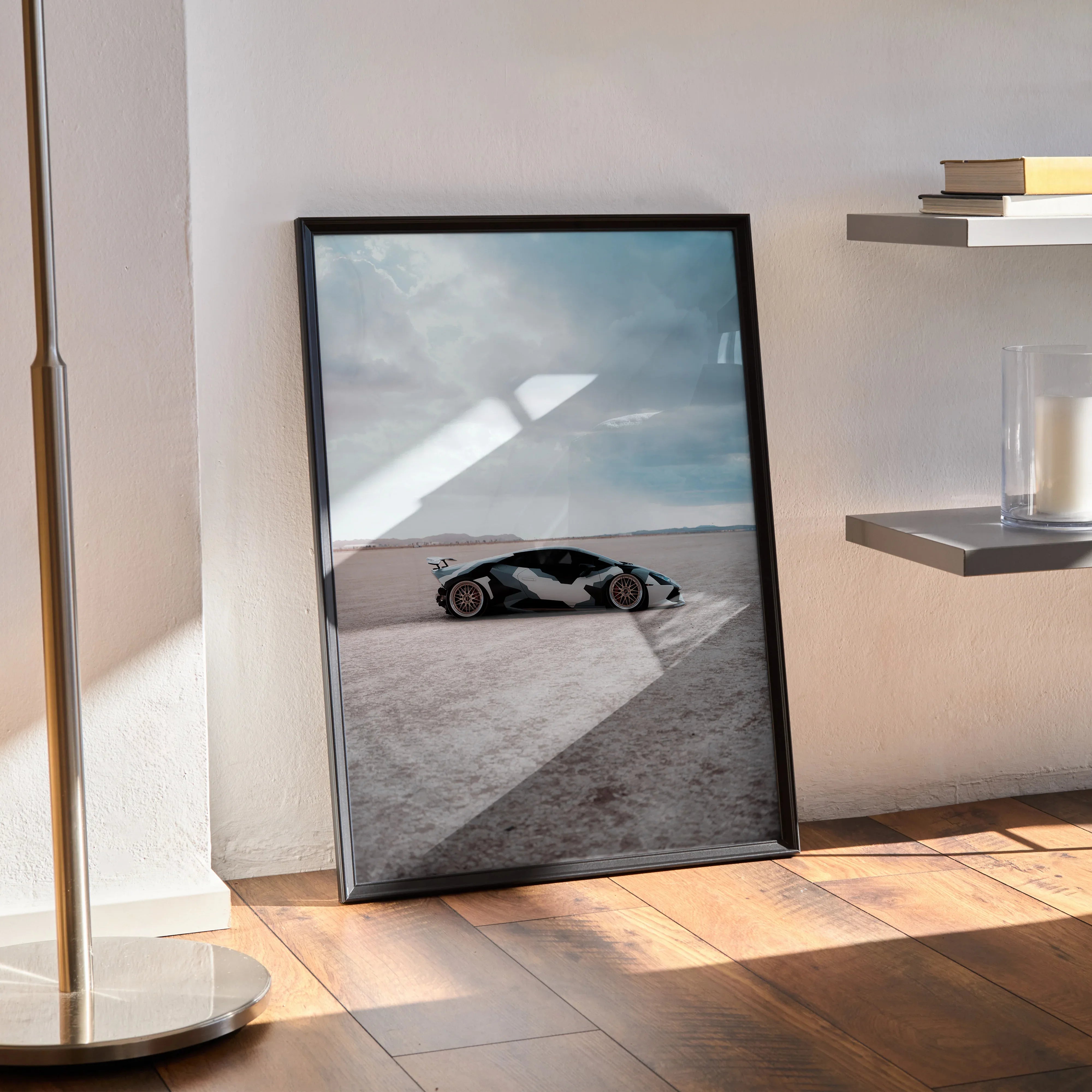 Lamborghini Huracan poster wall art showcasing a sleek black sports car on a light desert landscape under a cloudy sky.