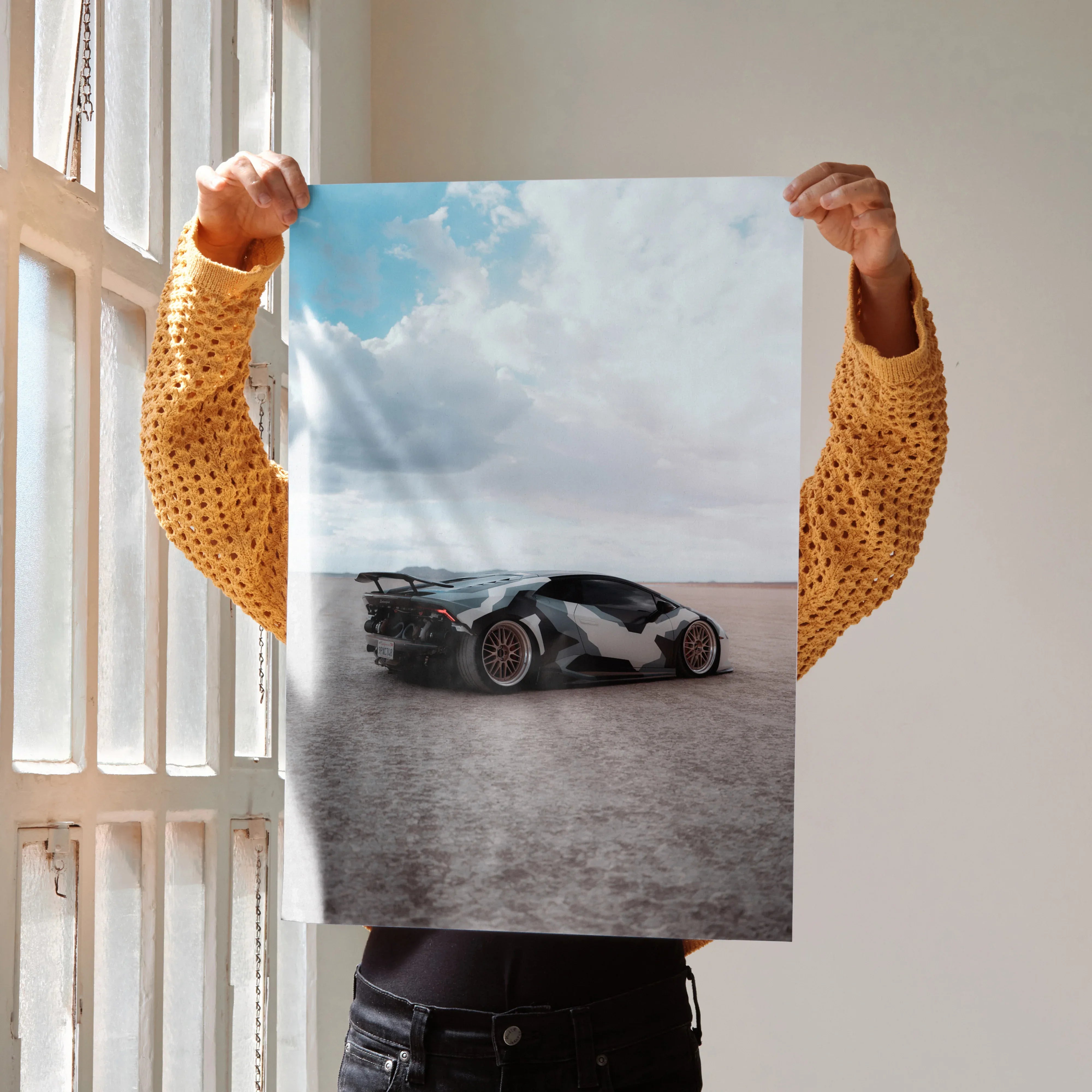 Lamborghini Huracan black and white car on dusty road poster wall art with blue sky background.
