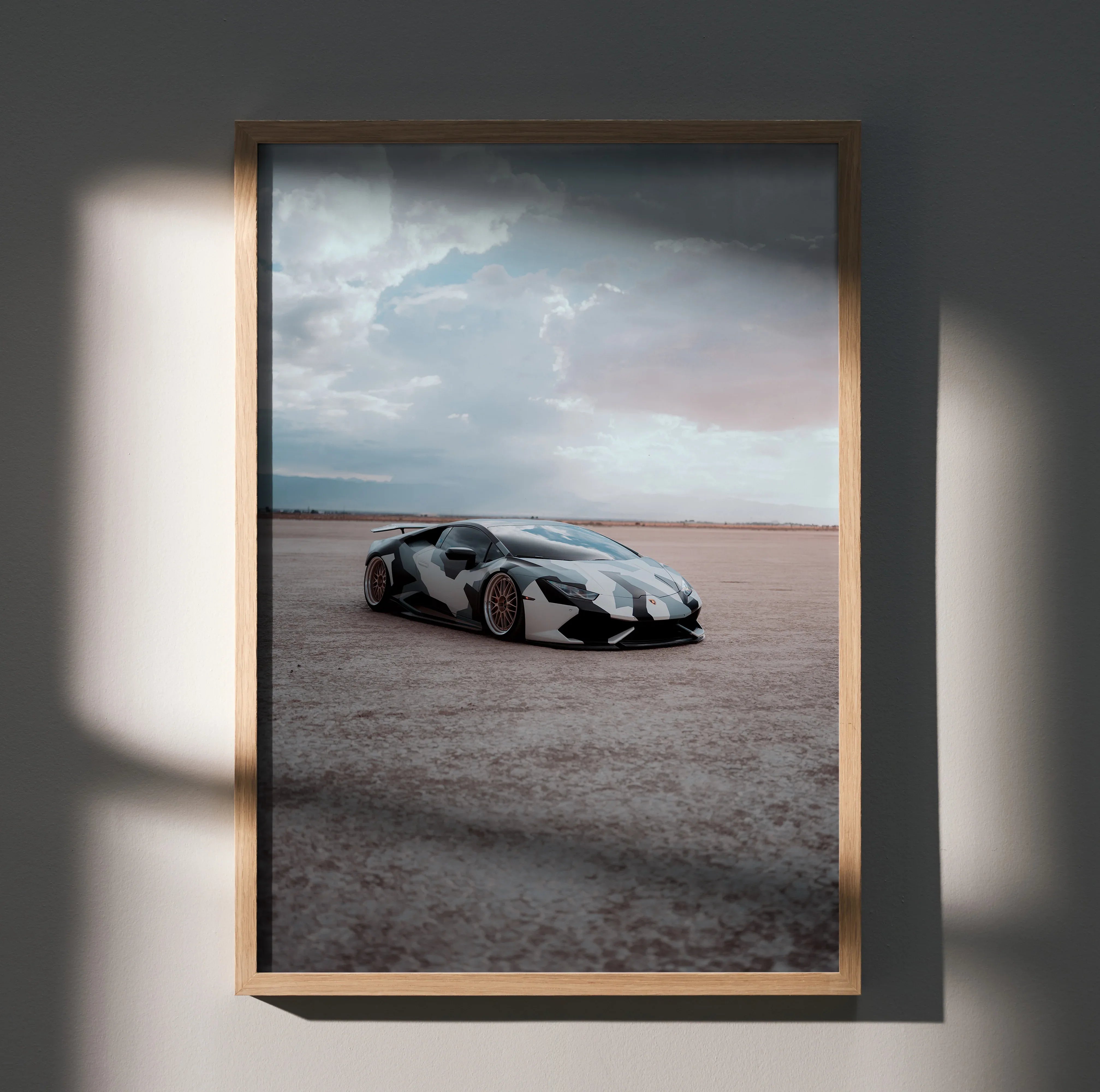 Lamborghini Huracan poster with sleek white and black car on desert road wall art.
