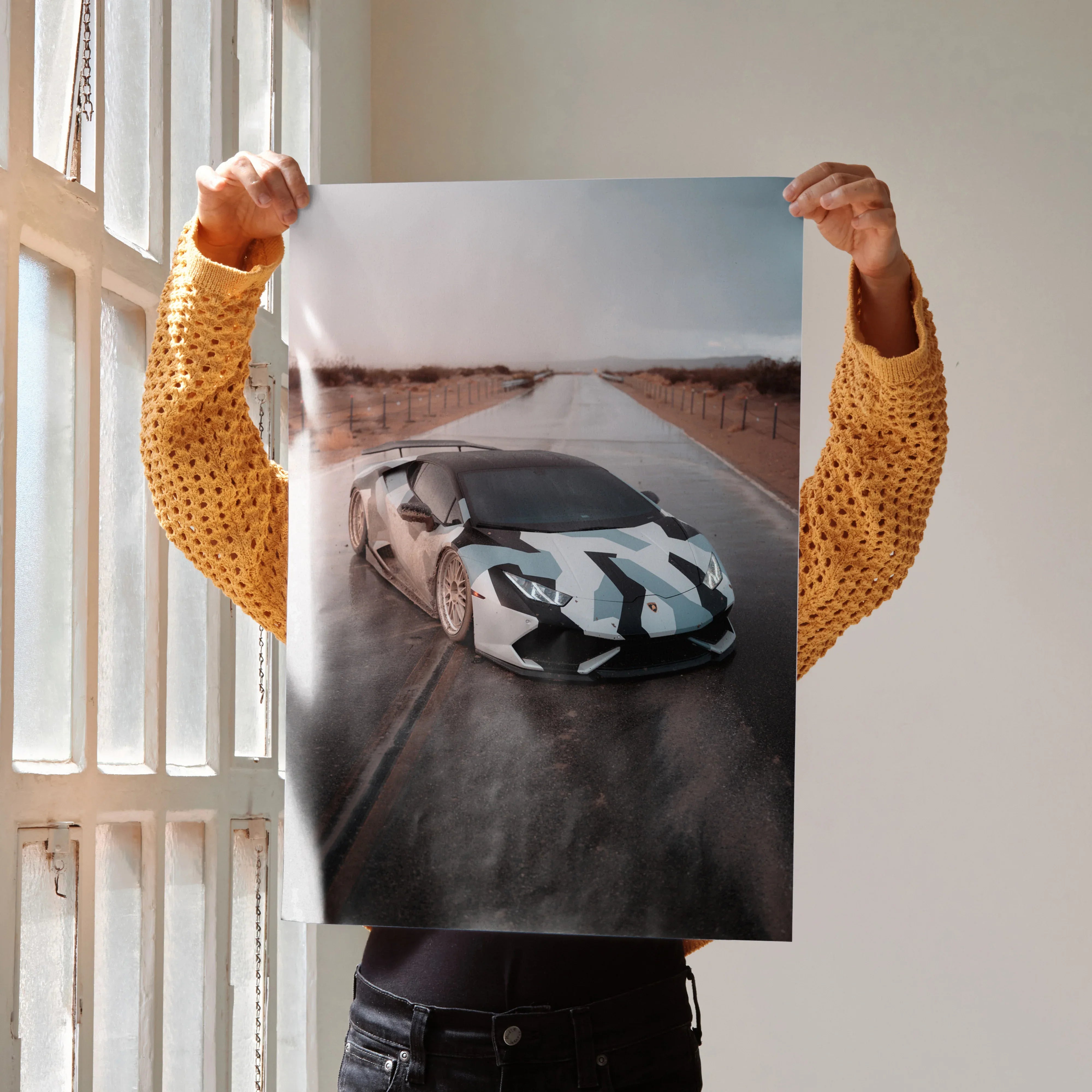 Lamborghini Huracan poster wall art featuring white sports car with black racing stripes on desert road.