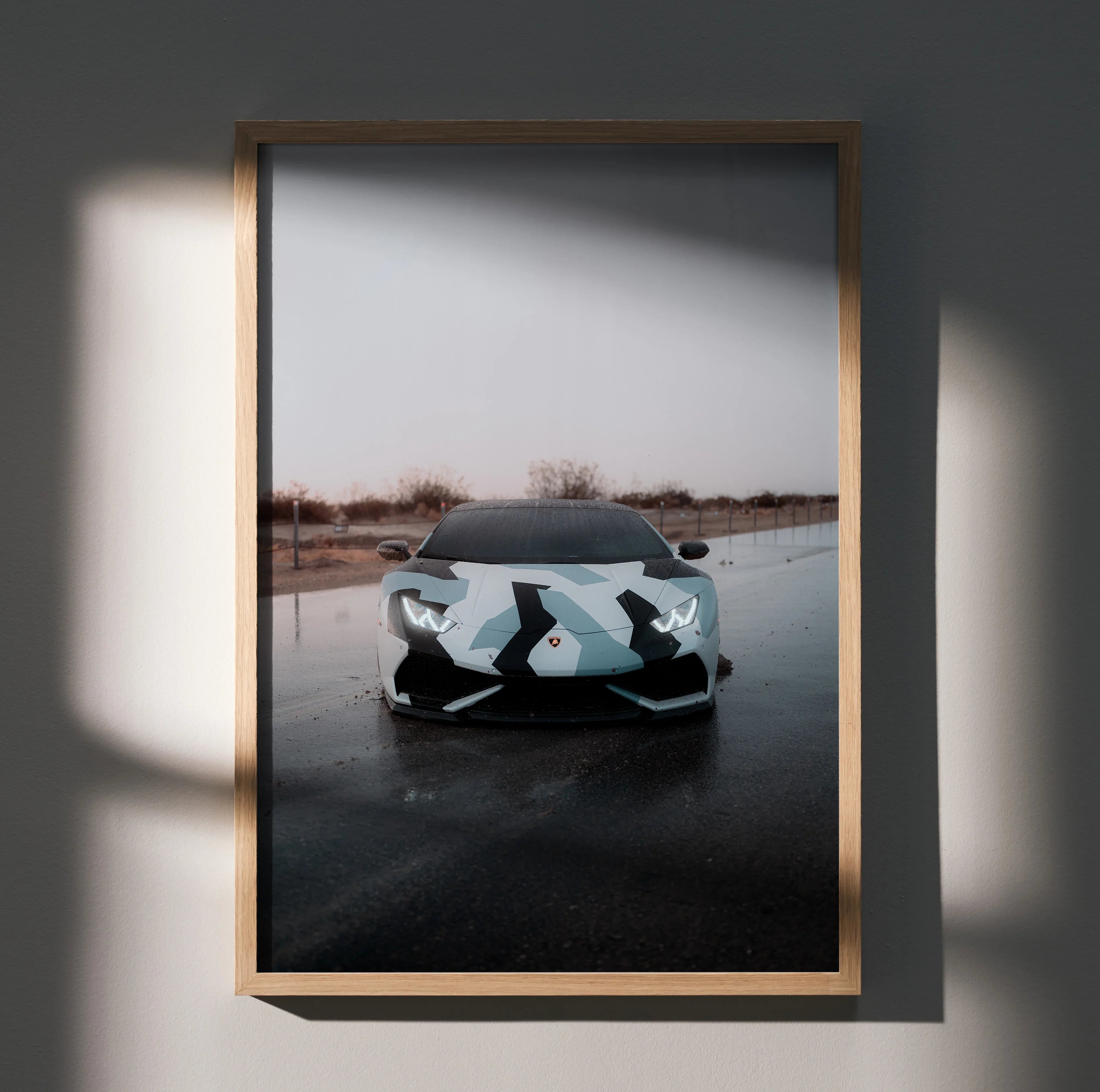 Lamborghini Huracan poster with sleek front view in muted outdoor setting, modern wall art.